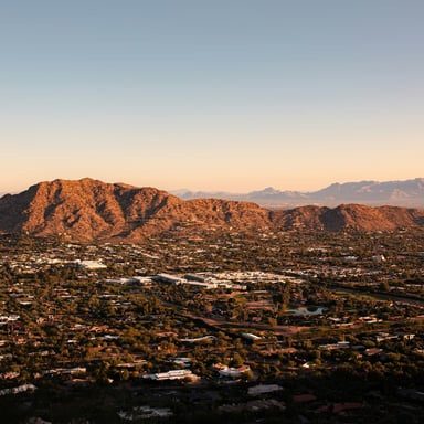 Aerial view of Phoenix with Camelback Mountain at sunset
