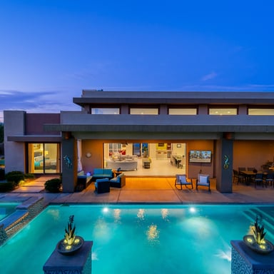 Modern desert home with pool at dusk