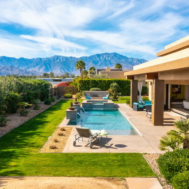 Desert backyard with pool and mountain views