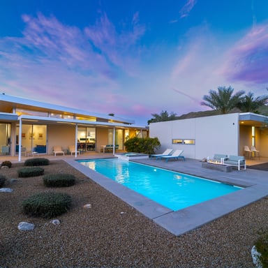 Mid-century desert home with pool at sunset