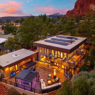 Aerial view of Sedona property at sunset with red rocks