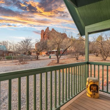 Sedona cabin porch with red rock views at sunrise