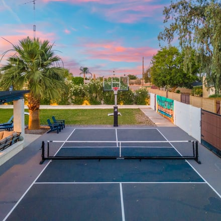Pickleball and basketball court at sunset
